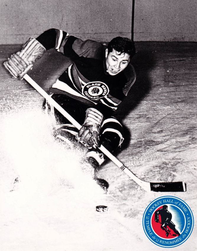 A historic black and white photo of a hockey player