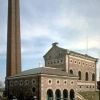 A waterworks with a chimney on blue sky background