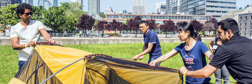 A group of people set up a tent in Montreal.