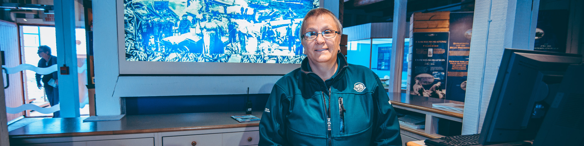 a Parks Canada employee standing at a desk