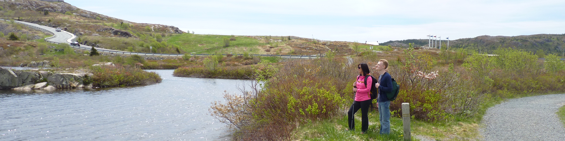 a man and a woman overlooking a pond