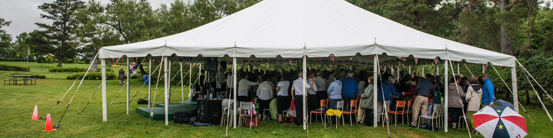 An event taking place under a giant tent.