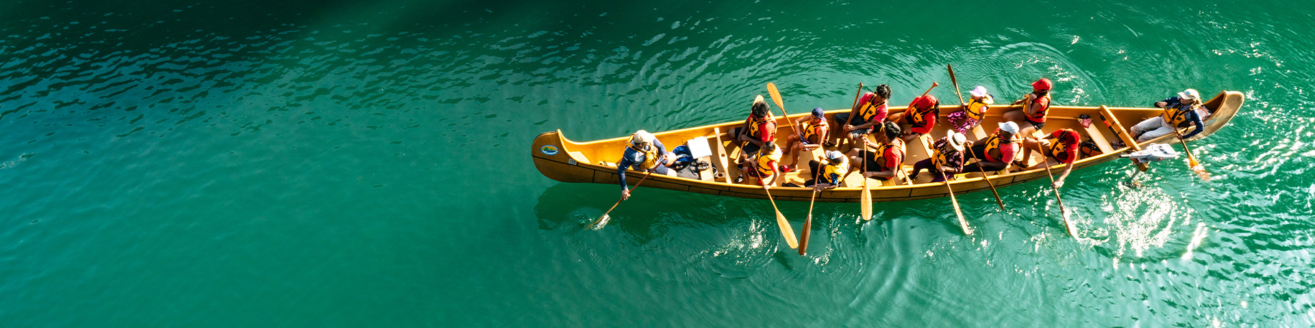 A large canoe going through the lock.