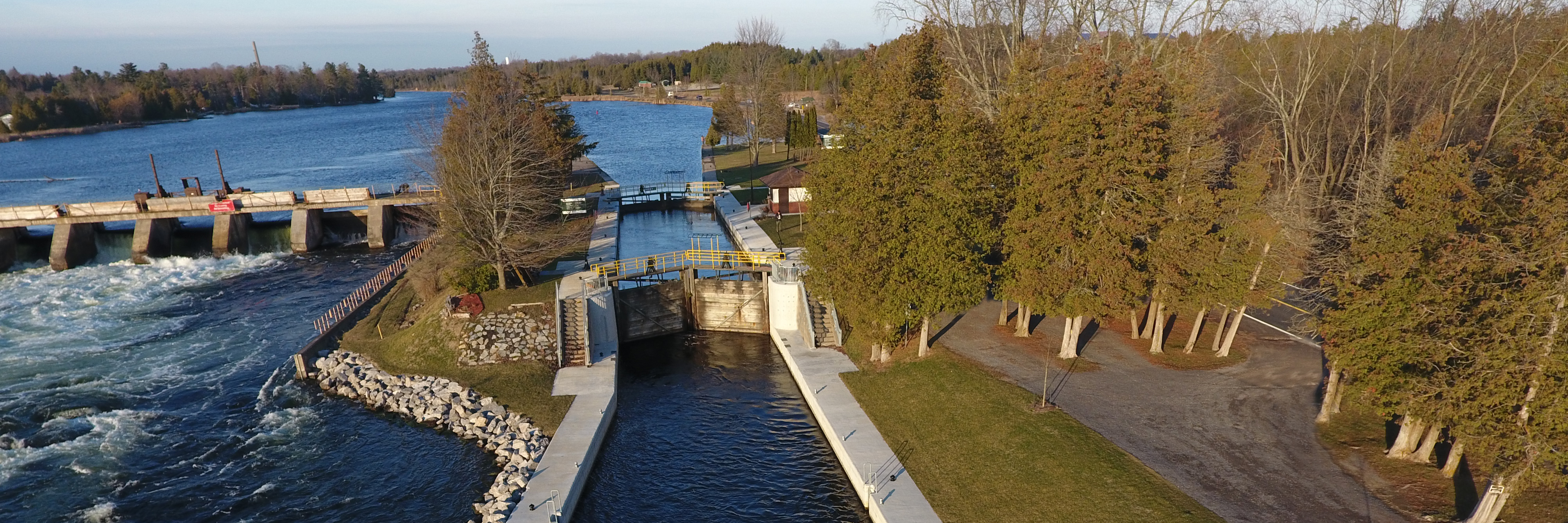 Aerial view of Sawer Creek Lock 25 demonstrating the newly repaired concrete approach walls. The Sawer Creek Dam and the white water exiting the dam is visible in the top left corner