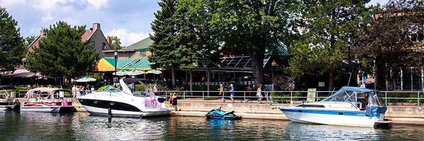 Boats moored at the Sainte-Anne-de-Bellevue canal during the summer season.