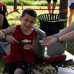 Boy enjoying food from the cooking activity