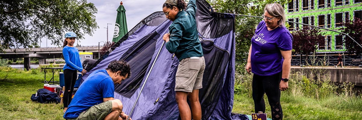 Parks Canada certified instructor who helps set up a tent.