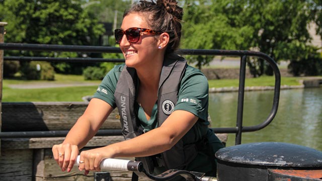 Lock operator cranking a lock gate at Chambly Canal National Historic Site. 