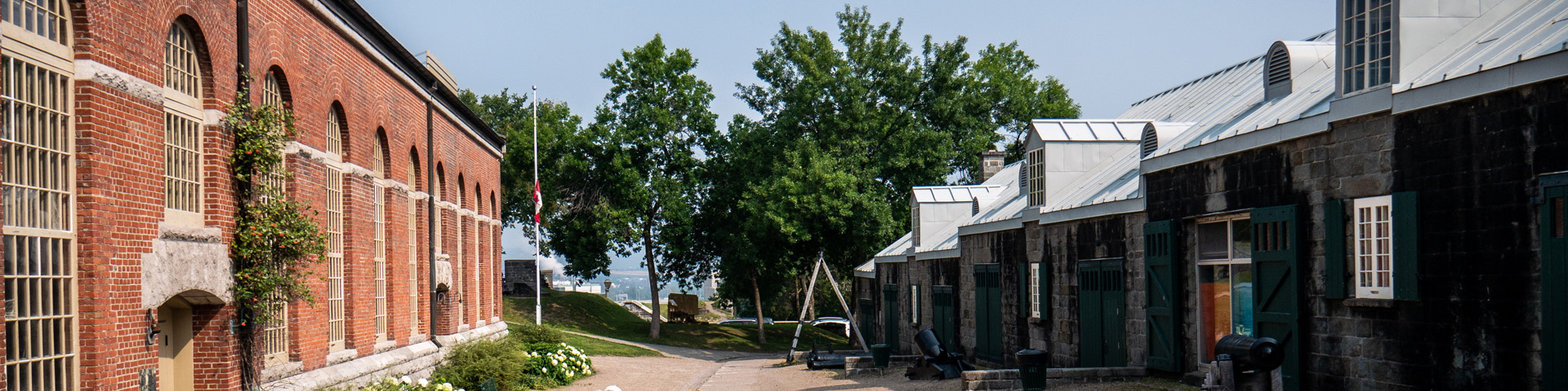  Path between a brick building and a stone building at Artillery Park in Quebec City.