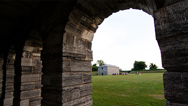 View of tour guides dressed as soldiers at Fort Lennox National Historic Site.