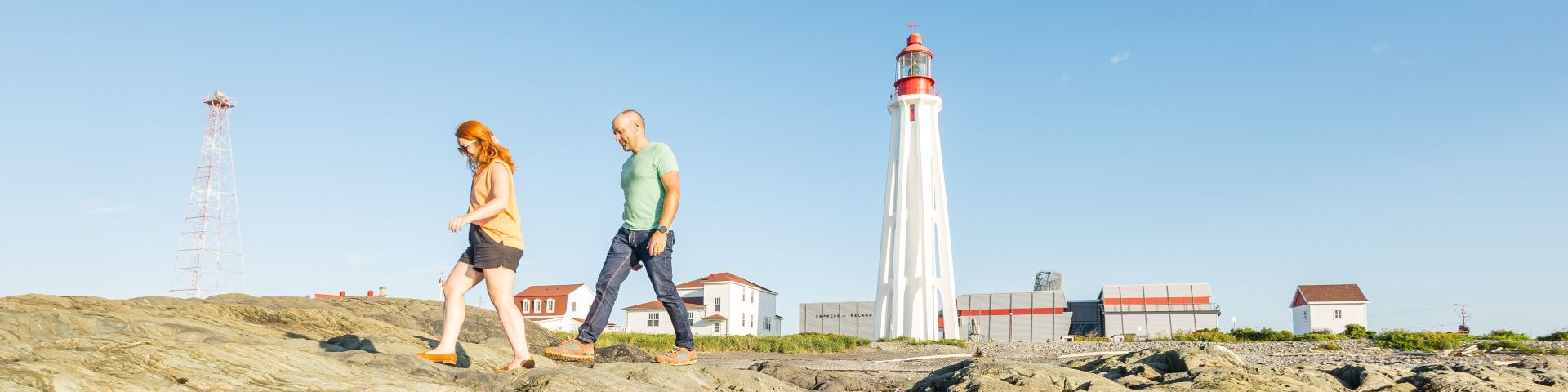 View of the lighthouse and its buildings along the shore