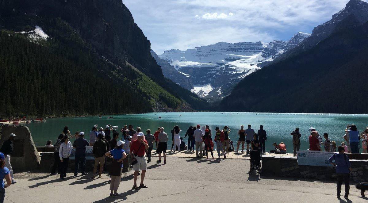 Visitors enjoying Lake Louise Lakeshore.