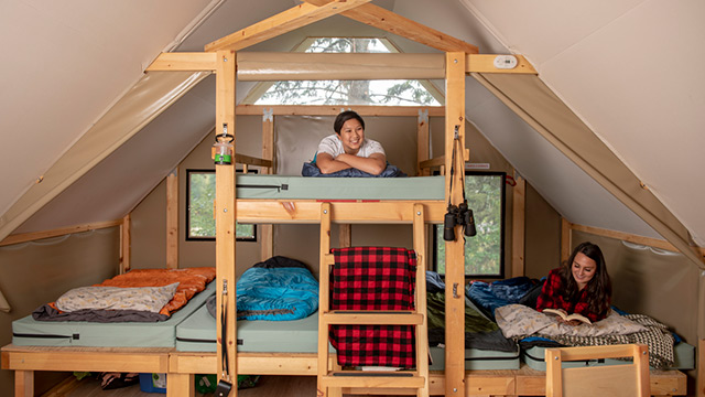 Campers enjoy the comfortable beds in Parks Canada oTENTiks... Elk Island National Park