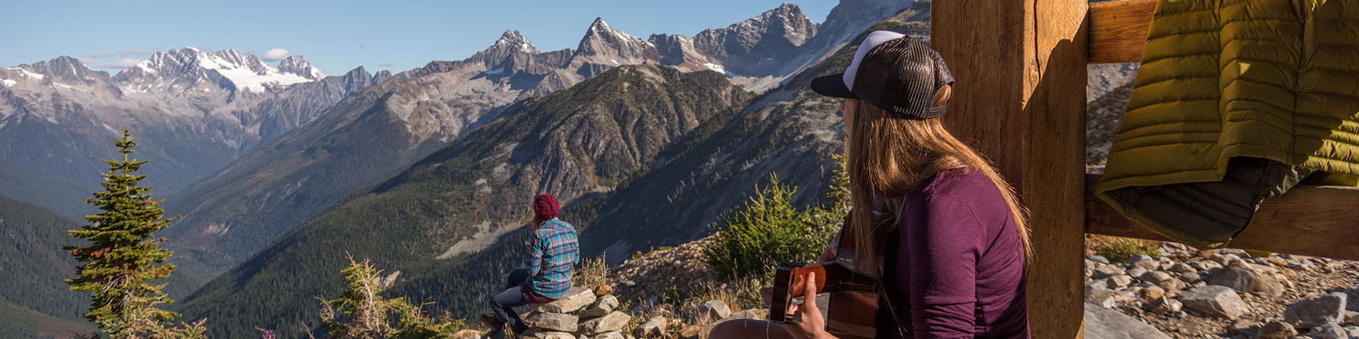 Two people looking out over a beautiful mountain view