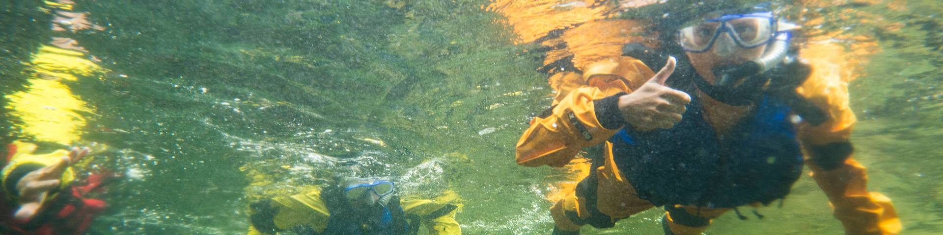 A person snorkeling underwater