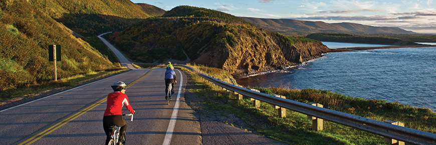 Cycling along the Cabot Trail near Le Buttereau