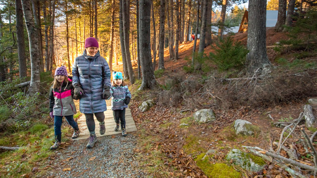 Woman and children hiking.