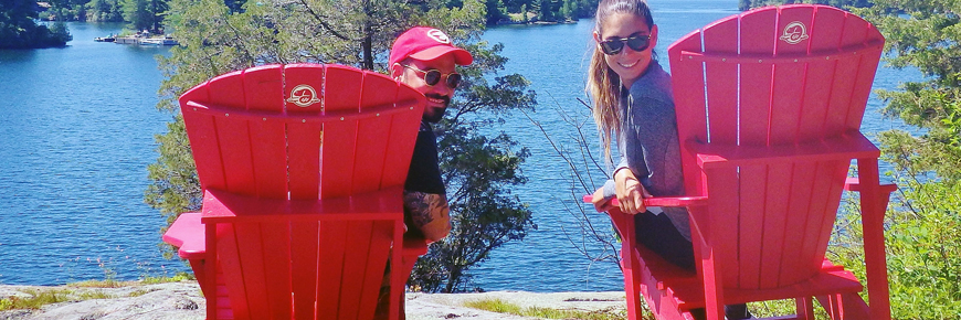 A couple sitting in red chairs