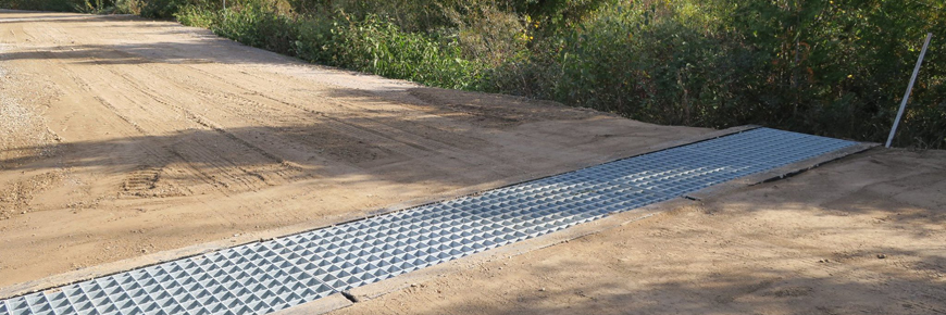 An ecopassage across a dirt road