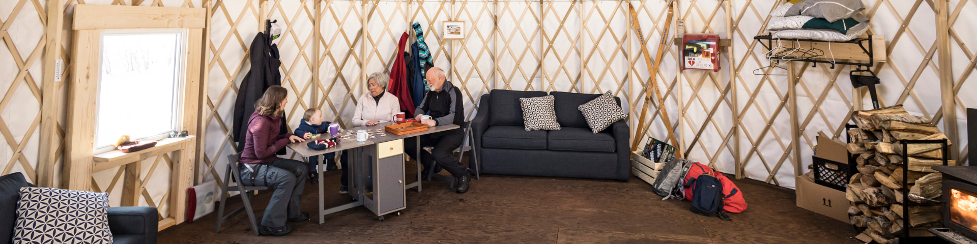 A family plays a board game on a table. 