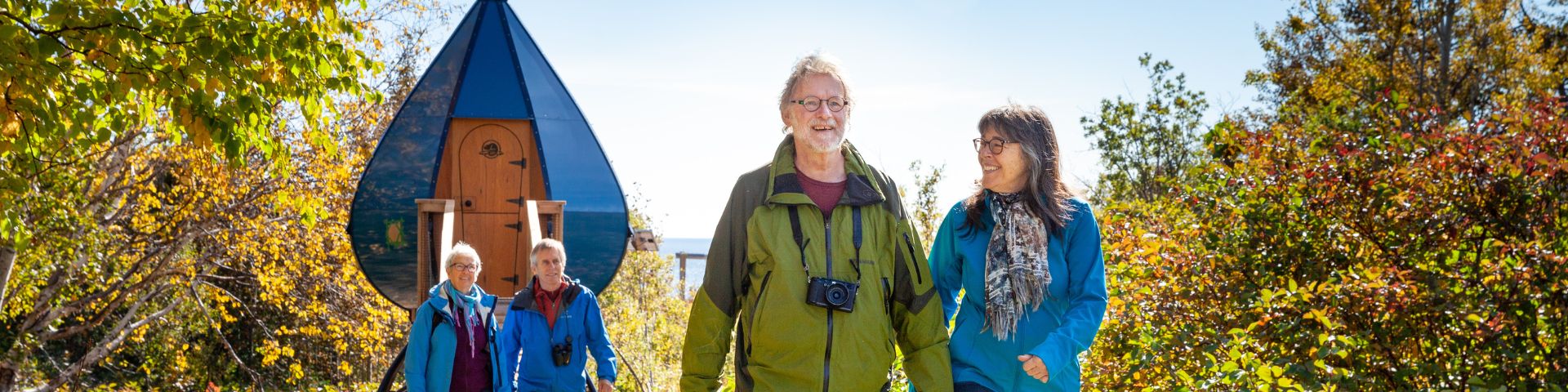 Two smiling couples leave their oasis accommodation